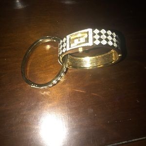 A set gold bracelet and watch
